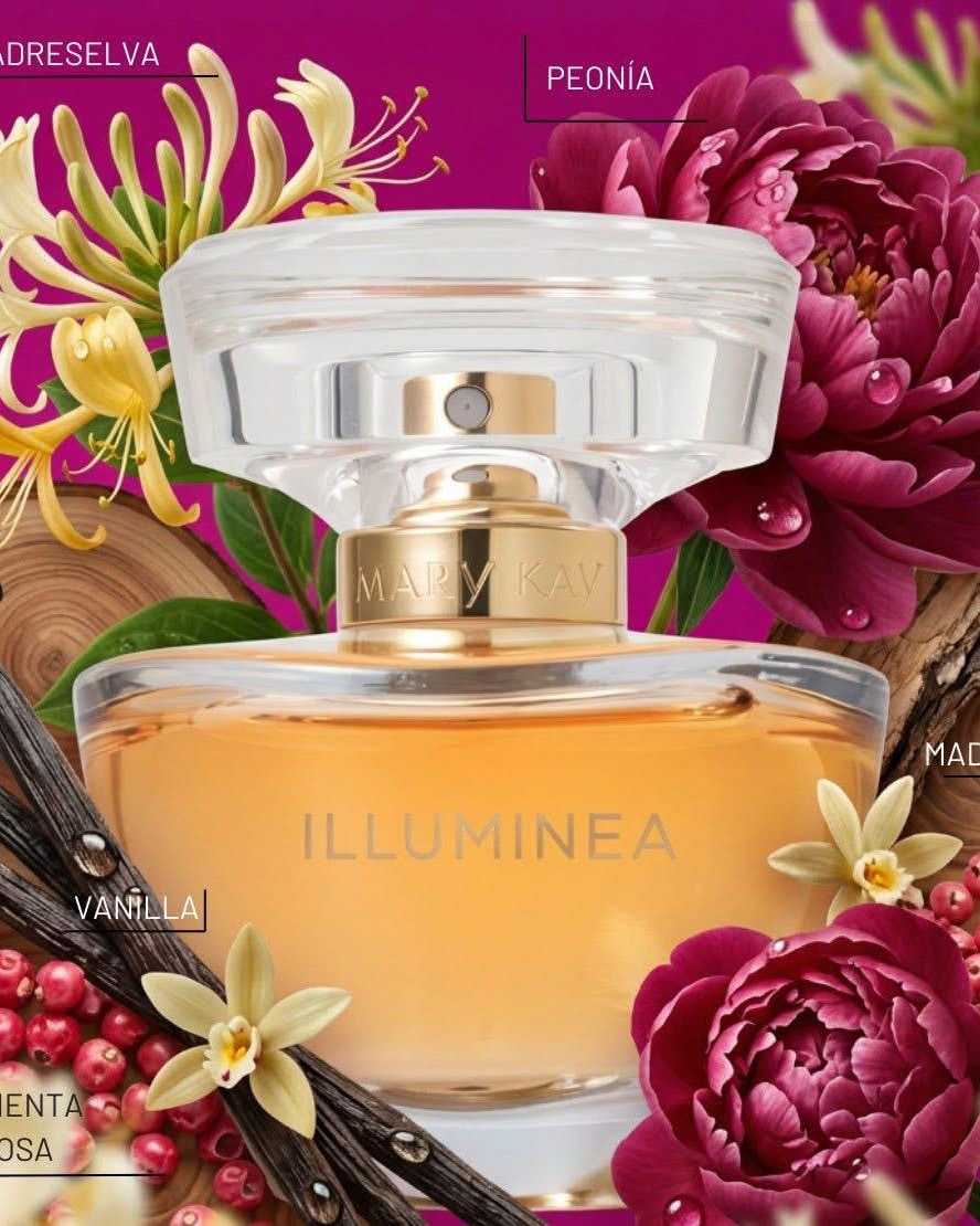 Round amber perfume bottle with a clear sculpted cap and gold collar, surrounded by peonies